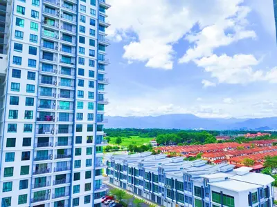 a tall white building with red roofs at Ipoh Meru Casa Kayangan 6 Pax Fully Air-Con Homestay in Ipoh