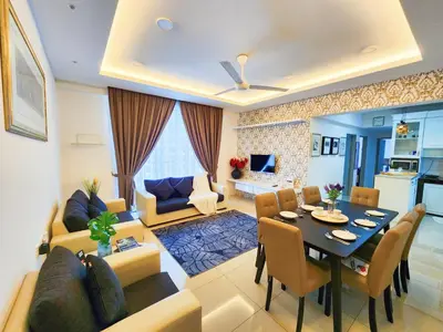 a living room with a table and a dining room at Ipoh Meru Casa Kayangan 6 Pax Fully Air-Con Homestay in Ipoh