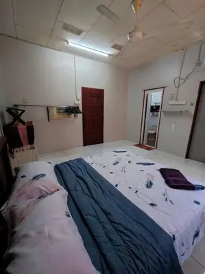 a bedroom with a large bed in a room at IlhamD' Homestay Kulim 5 Bedroom with 3 Toilet in Lunas