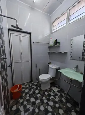 a small bathroom with a toilet and a sink at IlhamD' Homestay Kulim 5 Bedroom with 3 Toilet in Lunas
