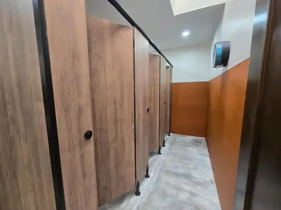 a row of wooden doors in a room at Hotel Ban Sheng Teik in Ipoh