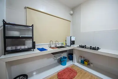 a kitchen with a sink and a counter top at De Luma TheRumah 5 bedroom 3 bathroom in Bukit Mertajam