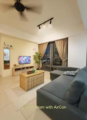 a living room with a couch and a tv at \u69df\u57ce\u4e2d\u8def\u4e09\u623f \u7231\u5c45\u5c4b in George Town