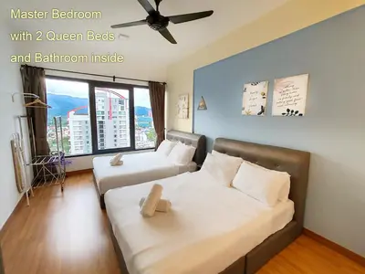 a bedroom with two queen beds and a bedroom inside at \u69df\u57ce\u4e2d\u8def\u4e09\u623f \u7231\u5c45\u5c4b in George Town