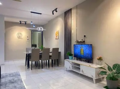 a dining room with a table with chairs and a television at 2 Storey Stylish Comfort Retreat ````AlmaImpianRia in Bukit Mertajam