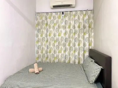 a bedroom with a bed with a teddy bear on it at 2 Storey Stylish Comfort Retreat ````AlmaImpianRia in Bukit Mertajam