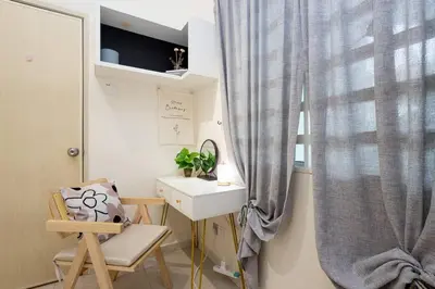 a room with a desk and a chair and a window at Retro Homestay Ipoh - Semi D 15pax Wedding in Ipoh