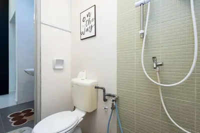 a bathroom with a toilet and a shower at Retro Homestay Ipoh - Semi D 15pax Wedding in Ipoh