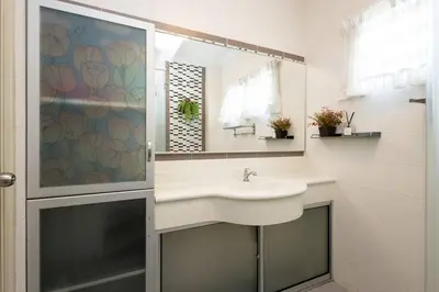 a bathroom with a sink and a mirror at Retro Homestay Ipoh - Semi D 15pax Wedding in Ipoh