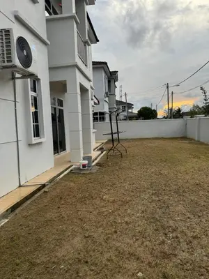 an empty yard in front of a house at Homestay Kakak Adek 3 in Parit Buntar