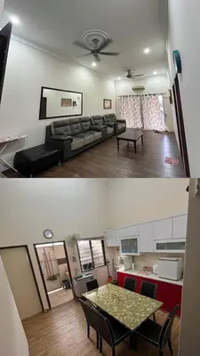 a living room with a couch and a table at Azriff homestay in Seri Iskandar