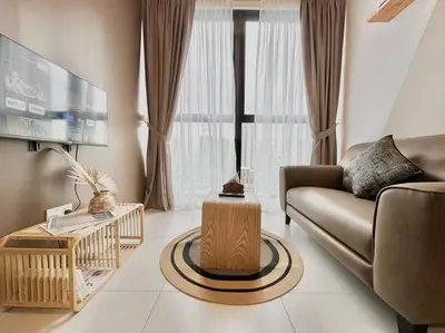 a living room with a couch and a table at Urban Suites #Walnut 1BR 1Bath suite #Infinity Pool #3pax #1Queen 1Single #Quality well maintained #Private host in Jelutong