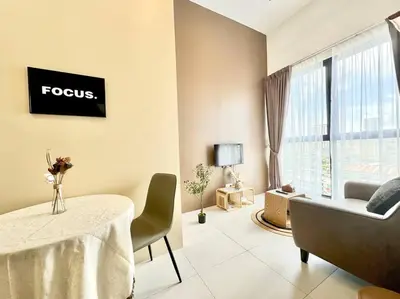 a living room with a table and a couch at Urban Suites #Walnut 1BR 1Bath suite #Infinity Pool #3pax #1Queen 1Single #Quality well maintained #Private host in Jelutong
