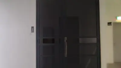 a black door with a window in a room at Sweet Home Ipoh Oasis Condominium in Ipoh