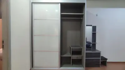 a glass cabinet with a mirror in a room at Sweet Home Ipoh Oasis Condominium in Ipoh