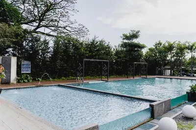 a large swimming pool with blue water at Sweet Home Ipoh Oasis Condominium in Ipoh