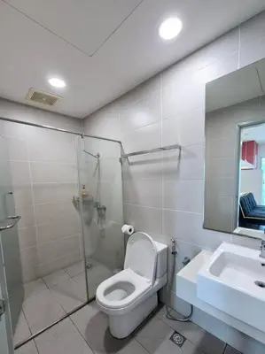 a bathroom with a shower and a toilet and a sink at Modern & Relax Studio Penang in George Town