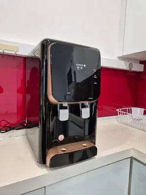 a black appliance sitting on top of a kitchen counter at Modern & Relax Studio Penang in George Town