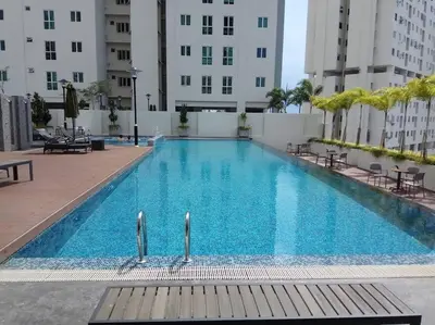 a large swimming pool in the middle of a building at Modern & Relax Studio Penang in George Town
