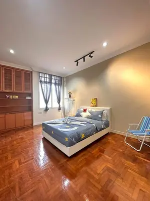 a bedroom with a large bed in a room at Melon Resort in Jelutong