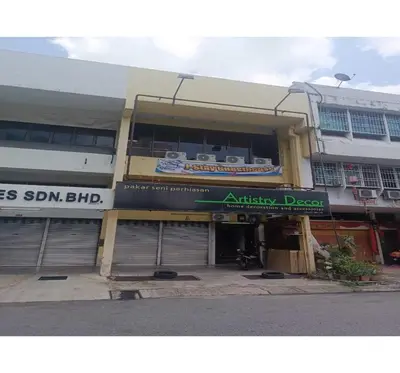 a building with an entrance to an apartment building at Hotel O J Stay Guesthouse in Jelutong
