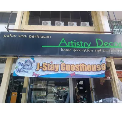 a sign for an entry to a home decoration and association at Hotel O J Stay Guesthouse in Jelutong