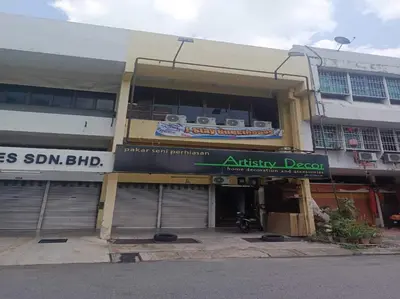 a building with an entrance to an office building at Hotel O J Stay Guesthouse in Jelutong