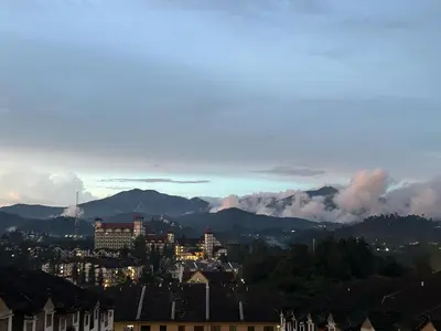 a view of a city with mountains in the background at Silvan Garden Cameron Highlands in Tanah Rata