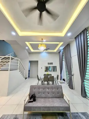 a living room with a couch and a ceiling at D'villa Aryan homestay with private pool in Sungai Petani
