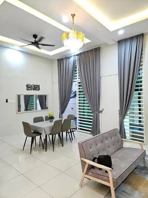 a living room with a couch and a table at D'villa Aryan homestay with private pool in Sungai Petani