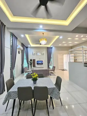 a dining room with a table and chairs at D'villa Aryan homestay with private pool in Sungai Petani