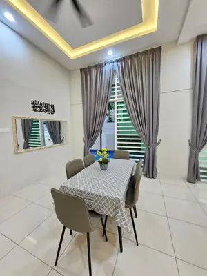 a dining room with a table and chairs at D'villa Aryan homestay with private pool in Sungai Petani