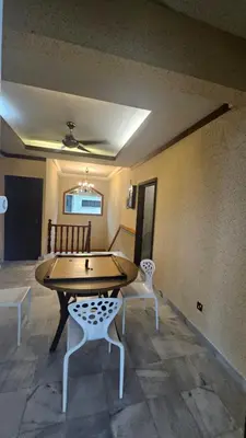 a room with a table and two chairs at Mount Lake Villa in Ipoh