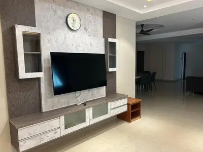 a living room with a flat screen tv on a wall at Orkid Apartment 2 in Cameron Highlands