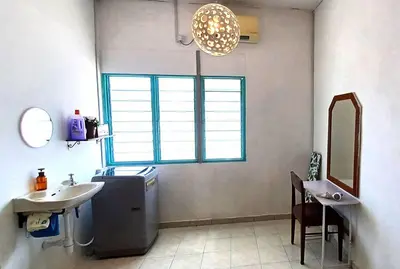 a bathroom with a sink and a mirror and a window at Pepper Hillside Village Home in Tanjung Bungah