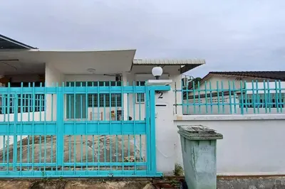 a blue gate in front of a house at Pepper Hillside Village Home in Tanjung Bungah