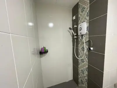 a shower with a glass door in a bathroom at Ipoh Town The Anderson Residence in Ipoh