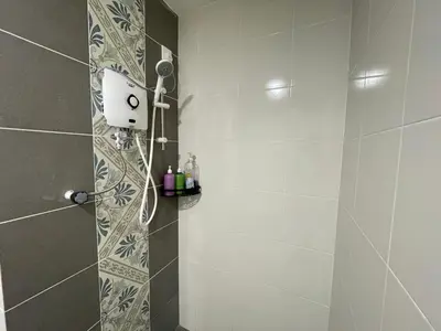 a bathroom with a shower with a shower head at Ipoh Town The Anderson Residence in Ipoh