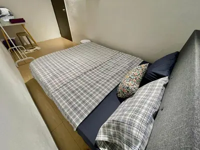 a bed with two pillows on it in a room at Home41#6pax#netflix#NearIconCity&AeonAlma in Bukit Mertajam