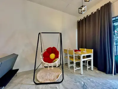 a swing with a flower on it in a room at Home41#6pax#netflix#NearIconCity&AeonAlma in Bukit Mertajam