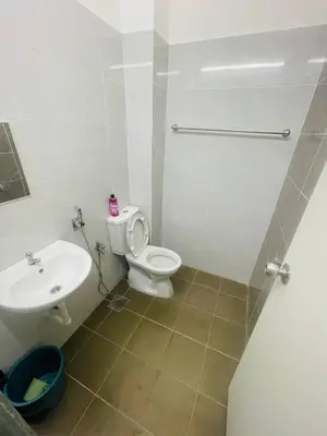 a bathroom with a toilet and a sink at D Alamanda Islam Homestay in Kuala Kangsar