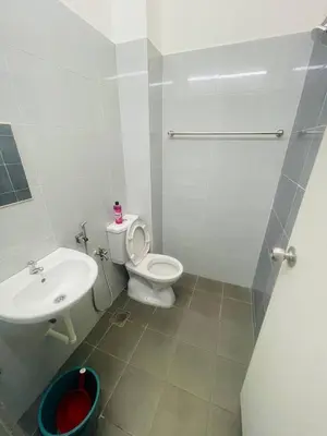 a bathroom with a toilet and a sink at D Alamanda Islam Homestay in Kuala Kangsar