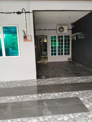 an open door of a house with a speaker at Homestay Lyn Impian in Tanjung Rambutan