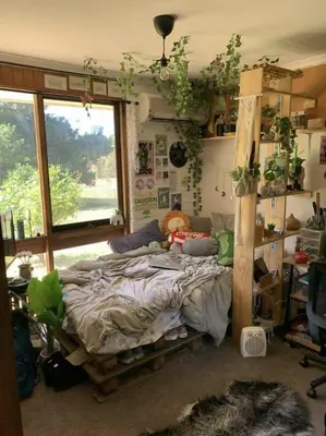 a bedroom with a bed with a teddy bear on it at Zaniera's Homestay in Tanah Rata