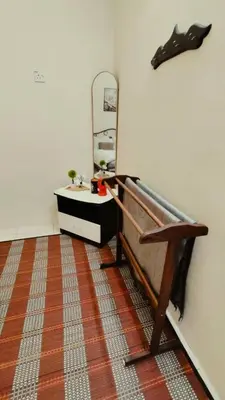 a room with a sink and a mirror on the wall at Musa Seri Iskandar Homestay in Seri Iskandar