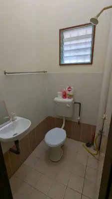 a bathroom with a toilet and a sink at Musa Seri Iskandar Homestay in Seri Iskandar