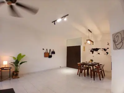a dining room with a table and chairs in a room at Noble Villa Condo Georgetown City Center Macalister 3 Bedroom 3 Carpark in George Town