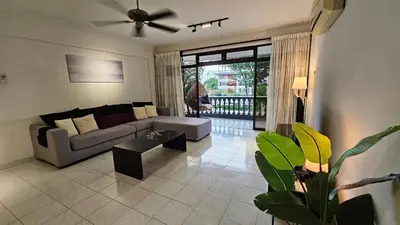 a living room with a couch and a table at Noble Villa Condo Georgetown City Center Macalister 3 Bedroom 3 Carpark in George Town