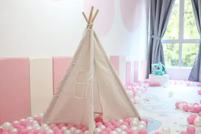 a birthday party with a teepee cake and pink balloons at Luxury Pokémon Haven with Private Playground Brinchang Cameron Highlands Clover Home 2-28 in Brinchang
