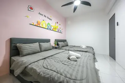 a bedroom with two beds and a ceiling fan at Luxury Pokémon Haven with Private Playground Brinchang Cameron Highlands Clover Home 2-28 in Brinchang